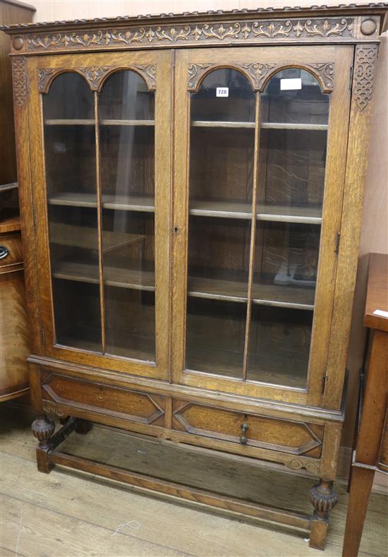 A carved oak bookcase W.107cm